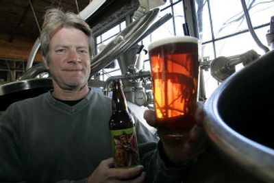 
 Dick Cantwell, head brewer at the Elysian Brewing Company, holds a glass of 