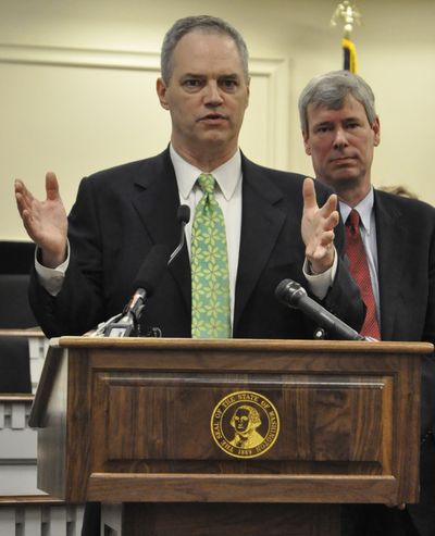OLYMPIA -- House Appropriations Committee Chairman Ross Hunter, D-Medina, describes a point in the House Democrats' 2015-17 budget proposal as Majority Leader Pat Sullivan, D-Covington, looks on. (Jim Camden)