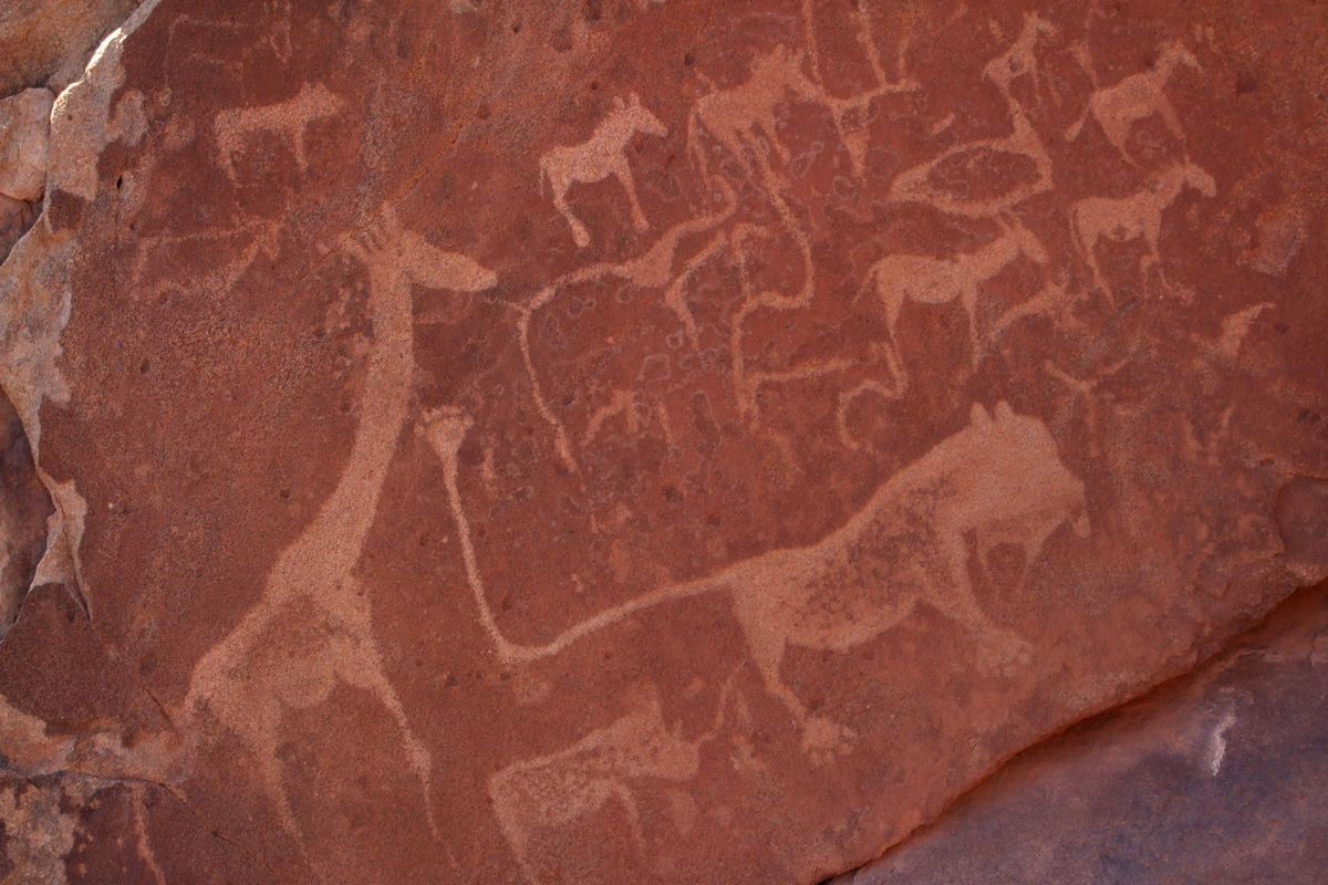Etchings left by the nomadic San people at Twyfelfontein, a national monument in Namibia. The site is near Damaraland Camp, a joint venture of the local community and a safari company in northwest Namibia.