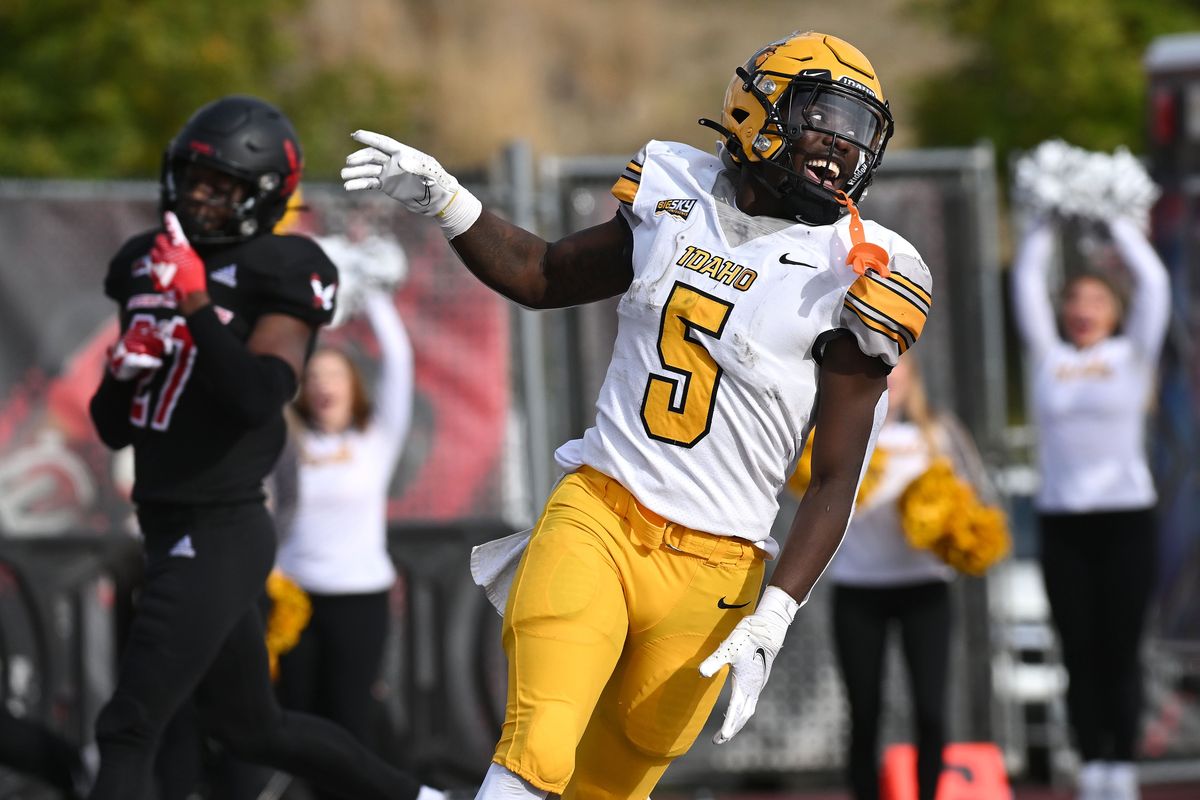 Idaho’s Anthony Woods celebrates one of his five rushing touchdown against Eastern Washington on Saturday. Woods rushed for 183 yards in the Vandals’ 44-36 win in Cheney.  (James Snook/FOR THE SPOKESMAN-REVIEW)