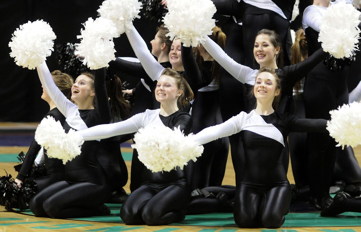 The Lewis and Clark High School drill team continues a tradition by performing during halftime of  a boys State 2B semifinal Friday night at the Arena.   (Colin Mulvany photos / The Spokesman-Review)