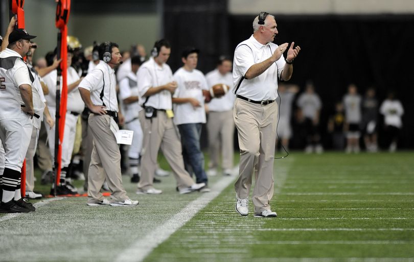 Idaho coach Robb Akey cheers his team against Hawaii during their game at the Kibbie Dome in October.  (CHRISTOPHER ANDERSON)