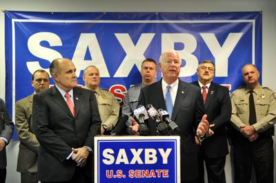 U.S. Sen. Saxby Chambliss, R-Ga., speaks at a press conference Tuesday joined by former New York City Mayor Rudolph Giuliani, left, at his campaign headquarters in Cobb County, Ga. (Associated Press / The Spokesman-Review)