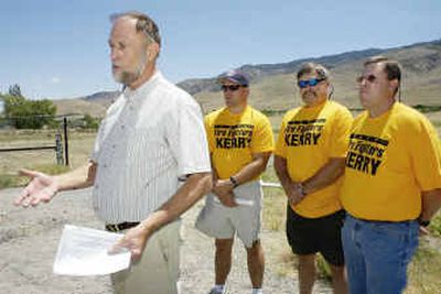 
Retired Forest Service employee Robert McDowell, left, is joined by firefighters from left, William Steward, Tim Lucich and Chris Ketring, during a news conference on the Kerry-Edwards Forest Plan in Nevada on Tuesday. McDowell spoke in favor of the proposed forest management plan.
 (Associated Press / The Spokesman-Review)