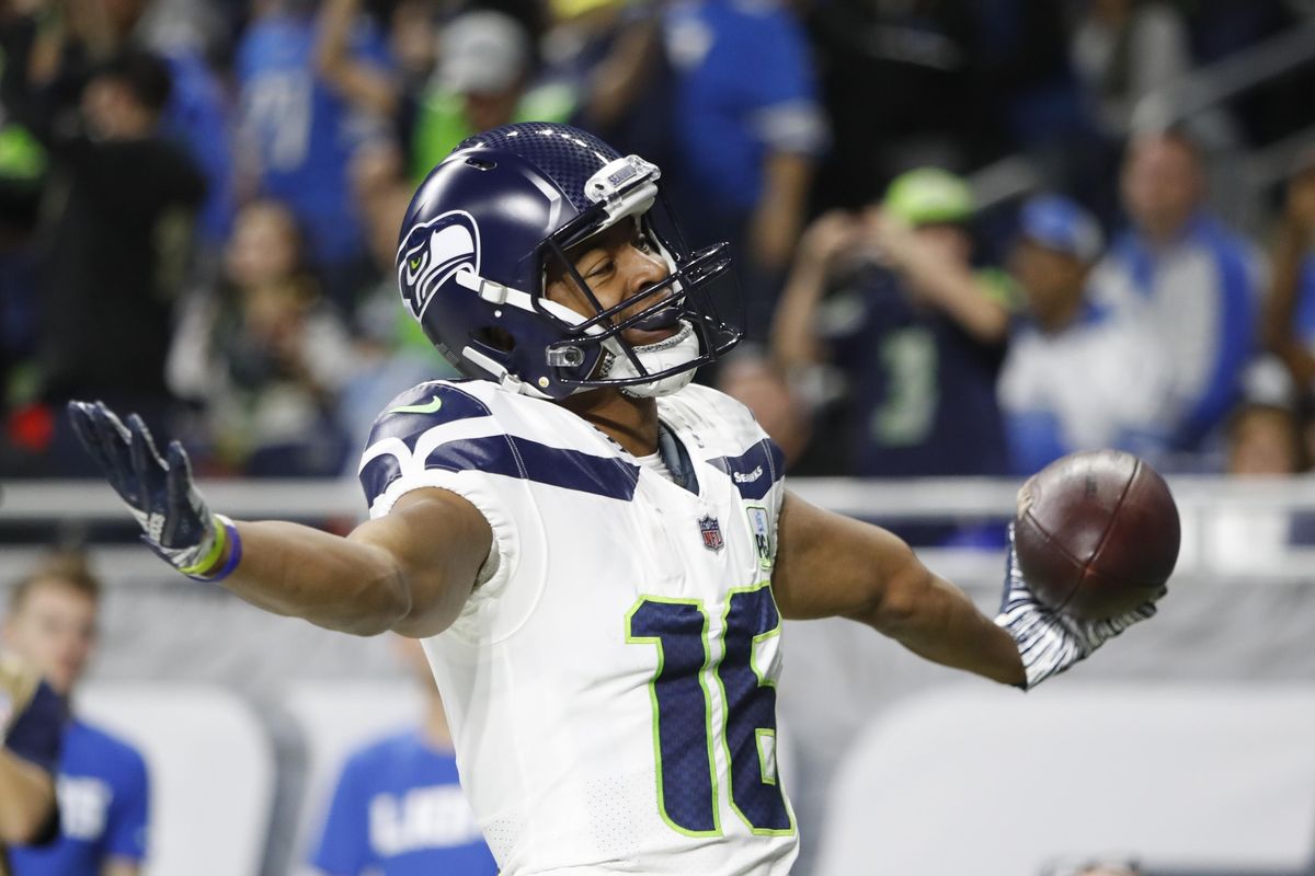 Seattle Seahawks wide receiver Tyler Lockett reacts after his 24-yard reception for a touchdown during the first half of a 28-14 win over the Detroit Lions on Sunday in Detroit. (Duane Burleson / AP)