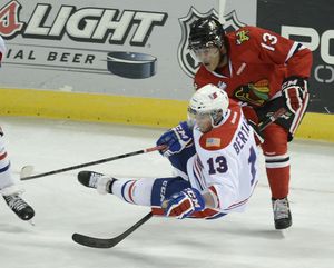 Spokane Chiefs Alessio Bechaggia is tripped up by Portland Winterhawks Keegan Iverson in the third period of their Western Conference Semifinals Game 3, Tuesday, April 9, 2013, in the Spokane Arena. (Colin Mulvany / The Spokesman-Review)