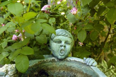 A water feature adorns Fred Carter's garden.
(The Spokesman-Review)