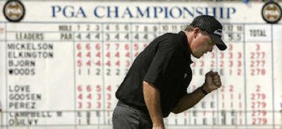 
Phil Mickelson pumps his fist after sinking a birdie putt on the 18th hole on Monday.
 (Associated Press / The Spokesman-Review)