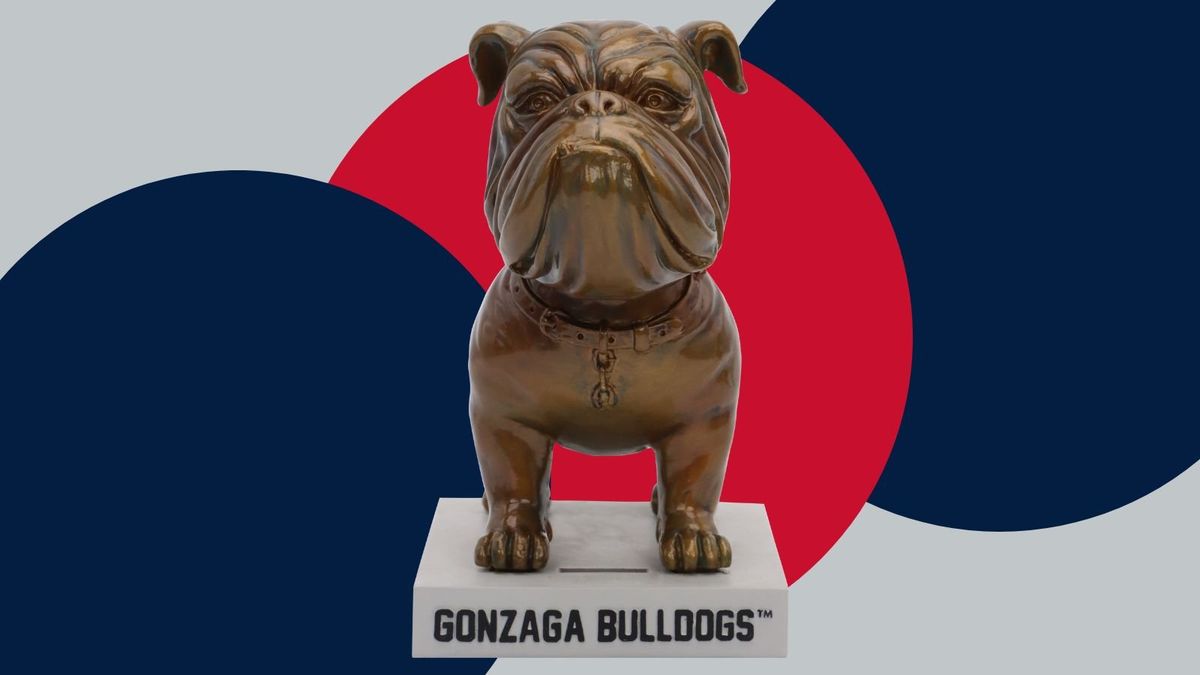 Gonzaga bulldog statue bobblehead stands in front of school colors.  (Courtesy of National Bobblehead Hall of Fame and Museum)