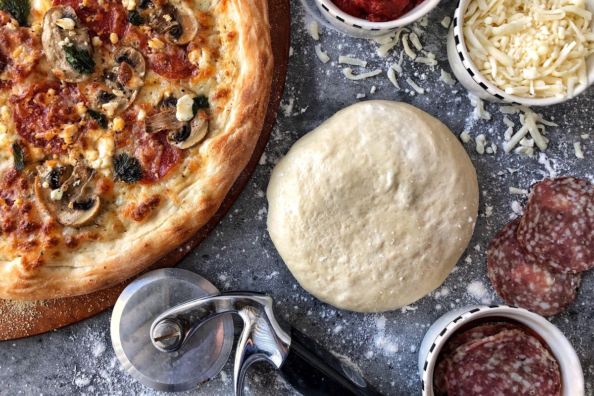This pizza dough recipe has only five ingredients along with water. (Audrey Alfaro / For The Spokesman-Review)