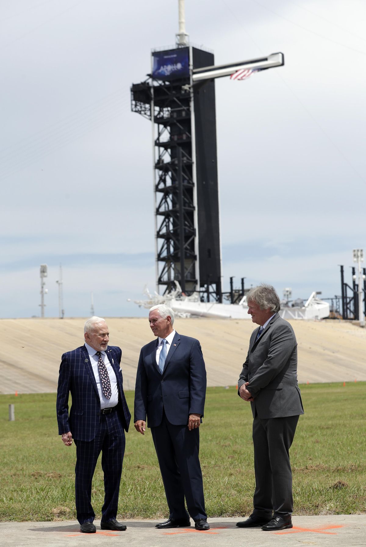 Apollo astronaut Buzz Aldrin, left, talks with Vice President Mike Pence, center, and Rick Armstrong, son of Apollo 11 astronaut Neil Armstrong, as they gather at pad 39a at the Kennedy Space Center where the launch of Apollo 11 took place 50 years ago on this anniversary of the moon landing, Saturday, July 20, 2019, in Cape Canaveral, Fla. (John Raoux / Associated Press)