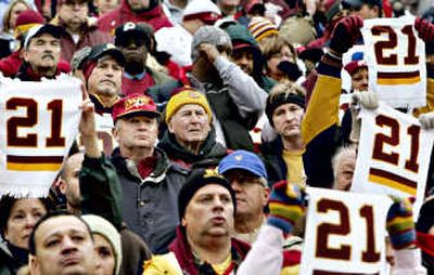 
Solemn fans hold up towels in memory of Redskins safety Sean Taylor during a ceremony before the game.Associated Press
 (Associated Press / The Spokesman-Review)
