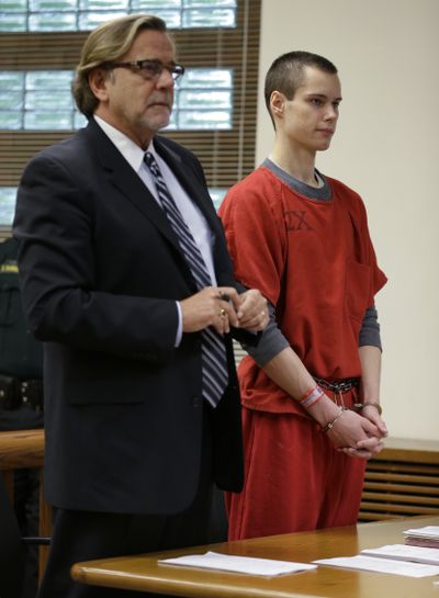 Colton Harris-Moore, right, stands in a Skagit County Superior Court room Wednesday with his attorney, John Henry Browne. (Associated Press)