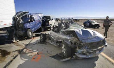 
Wreckage ready for transport sits atop a flatbed tow truck Tuesday in Lancaster, Calif.,  after a blinding sandstorm caused a 12-car pileup, killing at least two people and injuring 16. Associated Press
 (Associated Press / The Spokesman-Review)