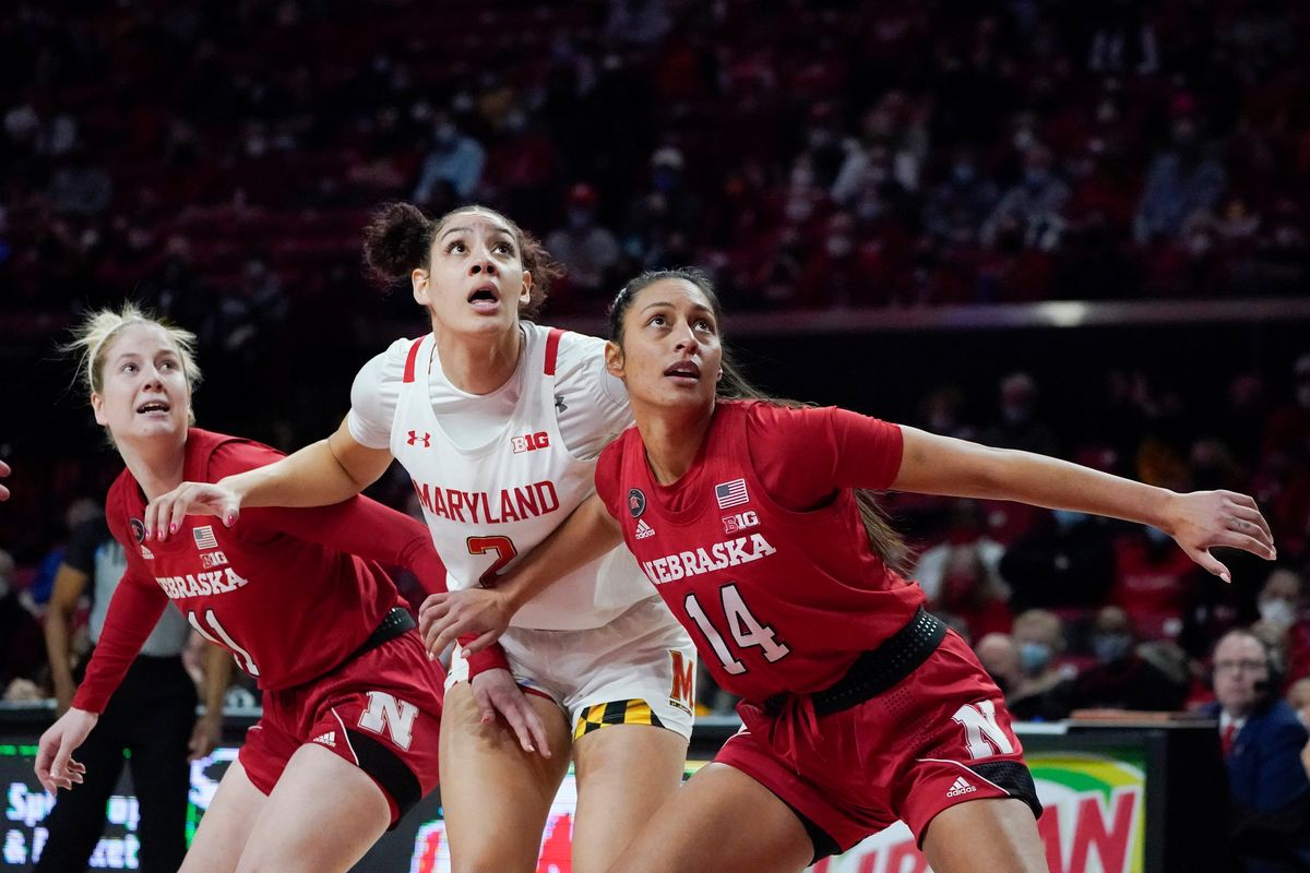 Nebraska’s Bella Cravens, right, and teammate Ruby Porter work to box out Maryland’s Mimi Collins on Feb. 6 in College Park, Md.  (Associated Press)