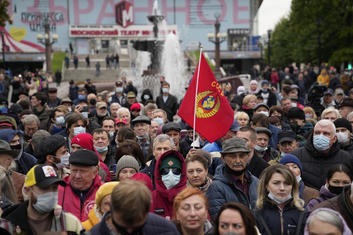 Demonstrators gather during a protest against the results of the Parliamentary election in Moscow, Russia, Saturday, Sept. 25, 2021. The Communist Party has called for a rally in Moscow on Saturday and was urged by the authorities Friday to remove the announcements from its website, otherwise it would be blocked — pressure that a party with seats in the parliament and which backs many of the Kremlin