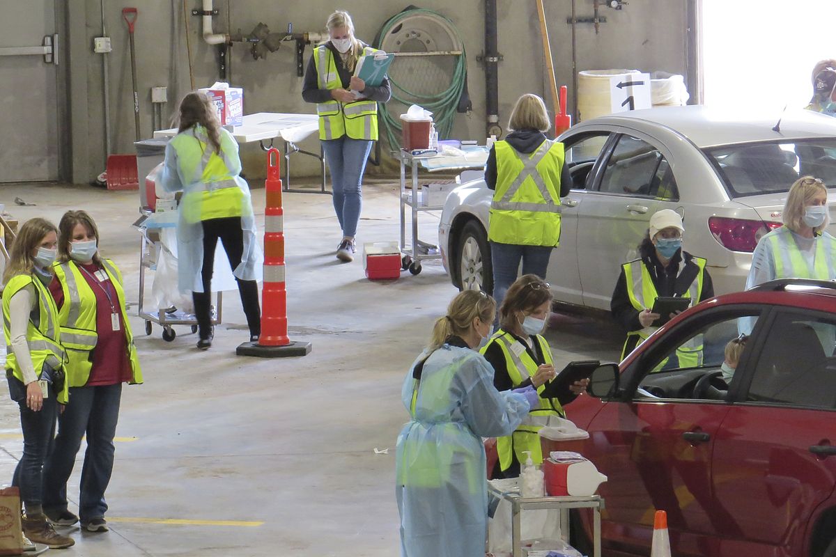 This 2020 photo provided by Carlton County shows their drive-thru flu clinic in Carlton, Minn. The facility is a way to social distance in the coronavirus pandemic, but also served as a test run for the COVID-19 vaccines that county health officials still know little about.  (Jared Hovi)