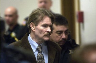 Kevin Coe is led into a courtroom at the Spokane County Courthouse on Dec. 18, 2006.
(Brian Plonka / The Spokesman-Review)