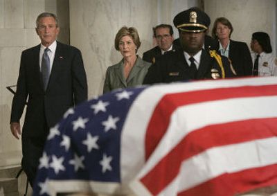 
President Bush and his wife, first lady Laura, come to pay respects to U.S. Supreme Court Chief Justice William Rehnquist as his body lay in repose at the Supreme Court Tuesday in Washington.
 (Associated Press / The Spokesman-Review)