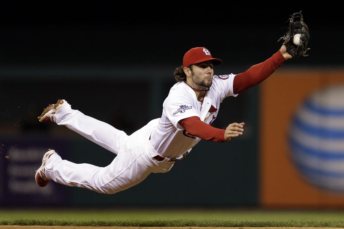 Cardinals shortstop Pete Kozma makes diving catch. (Associated Press)