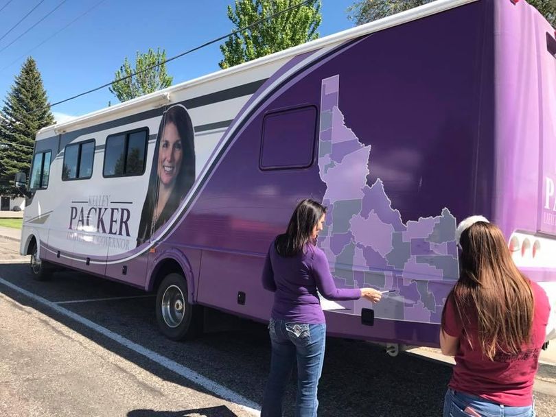 Idaho state Rep. Kelley Packer looks at the signable map of Idaho on her campaign-logo RV; she’s one of five GOP candidates running for Idaho lieutenant governor. (Kelley Packer campaign)