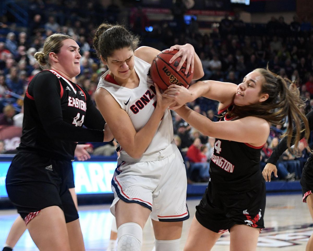 Gonzaga forward Anamaria Virjoghe (1) tries to hold on to a rebound as Eastern Washington guard Jessica McDowell-White (4) reach for the ball during the first half of a college basketball game, Fri., Nov. 22, 2019, at the McCarthey Athletic Center. (Colin Mulvany / The Spokesman-Review)
