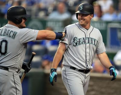 The Mariners’ Jay Bruce, right, is congratulated by teammate Daniel Vogelbach, left, after his solo home run during the first inning against the Kansas City Royals at Kauffman Stadium in Kansas City, Mo., Tuesday, April 9, 2019. (Orlin Wagner / Associated Press)