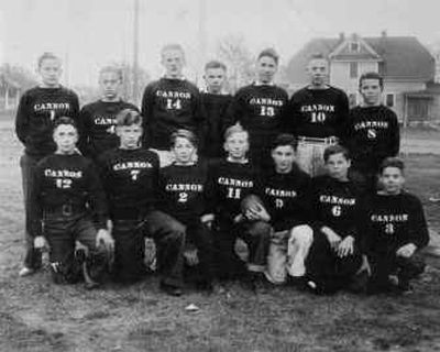 
In the early-1930's there was a tackle football league that attracted players from all over Spokane. The teams represented various parks from the city. As the photo shows, there wasn't much equipment involved, just a desire to play. 
 (Photo submitted by Kathy Robb (who's father, wearing No. 2 on his jersey, played on the team). / The Spokesman-Review)