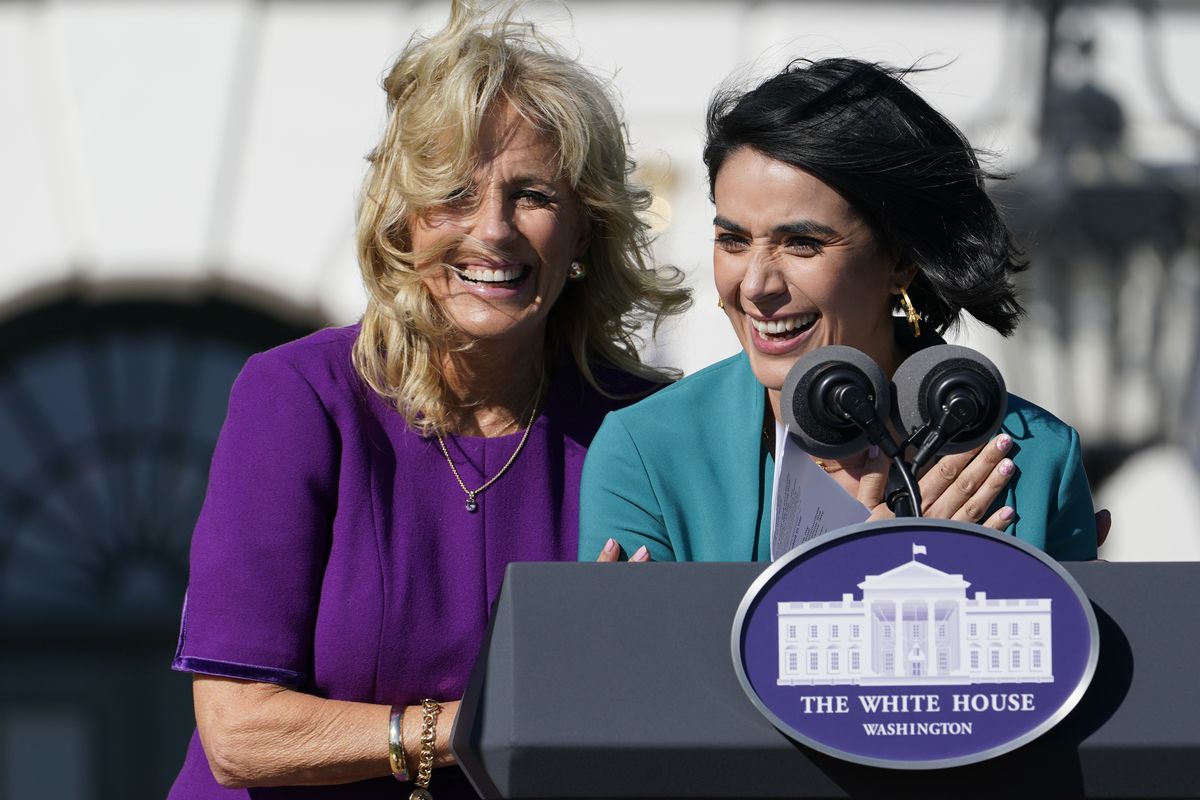 First lady Jill Biden comes over to comfort 2021 National Teacher of the Year Juliana Urtubey, a bilingual special education teacher in Las Vegas, who was emotional as she spoke during an event with 2020 and 2021 State and National Teachers of the Year on the South Lawn of the White House in Washington, Monday, Oct. 18, 2021.  (Susan Walsh)