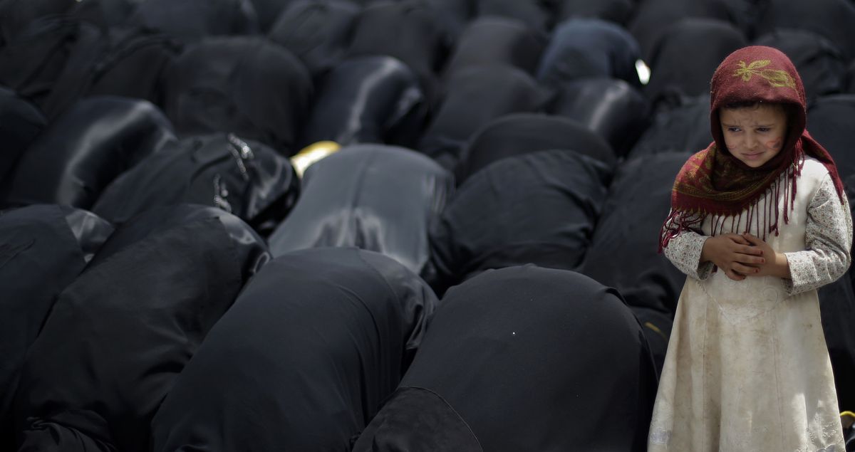 A Yemeni girl prays with anti-government protesters demanding the resignation of Yemeni President Ali Abdullah Saleh, in Sanaa, Yemen, on Saturday. (Associated Press)