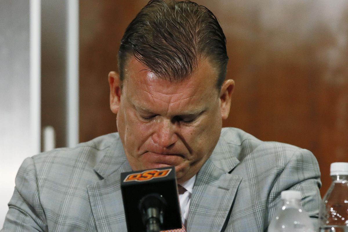 Oklahoma State basketball coach Brad Underwood fights back tears at a news conference in Stillwater, Okla., Friday, July 22, 2016. Oklahoma State basketball player Tyrek Coger died after a 40-minute team workout on the football stadium stairs in hot weather, Thursday, July 21, 2016. (Sue Ogrocki / Associated Press)