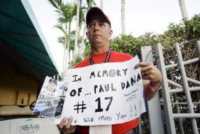 
IRL fan Tim Mincey displays a sign honoring Paul Dana. 
 (Associated Press / The Spokesman-Review)