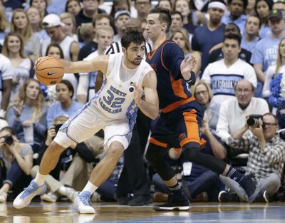 North Carolina's Luke Maye, left, dribbles while Bucknell's Zach Thomas defends during the second half of an NCAA college basketball game in Chapel Hill, N.C., Wednesday, Nov. 15, 2017. (Gerry Broome / Associated Press)