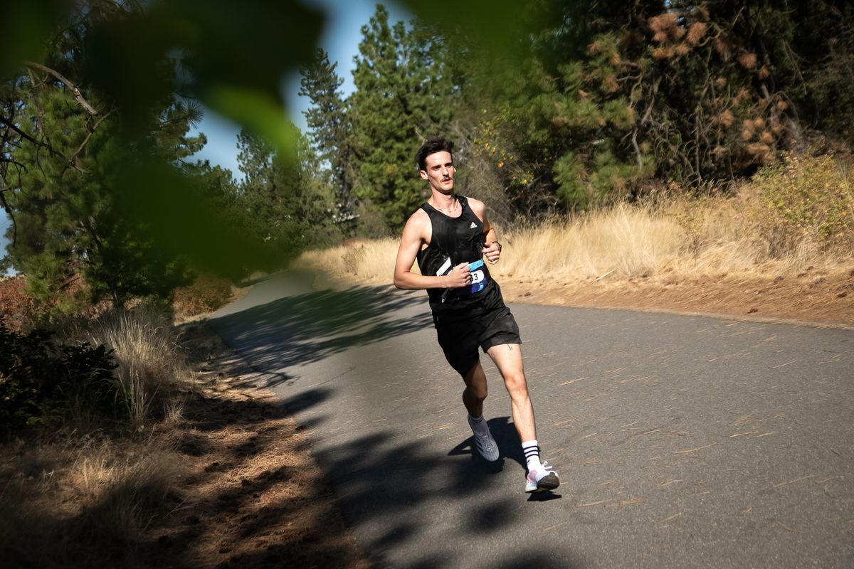First place winner of the Windermere Marathon, Dennis McDuffie, runs the last quarter mile of the race on Sunday, Sept. 6, 2020 in Spokane Valley, Washington. The 24-year-old hails from Miami and completed the full marathon with a time of 2:52:00.0.  (Libby Kamrowski/ THE SPOKESMAN-REVIEW)