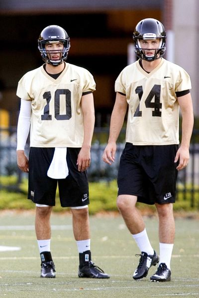 Jake Luton, right, with University of Idaho quarterback Matt Linehan, has decided to transfer to another school. (Geoff Crimmins / Associated Press)