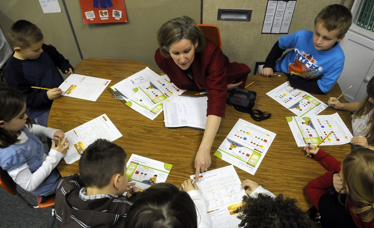 The Spokesman-Review Ponderosa Elementary School first-grade teacher Ellen Briggs works with her students Wednesday using the  MathConnects program. (Dan Pelle / The Spokesman-Review)