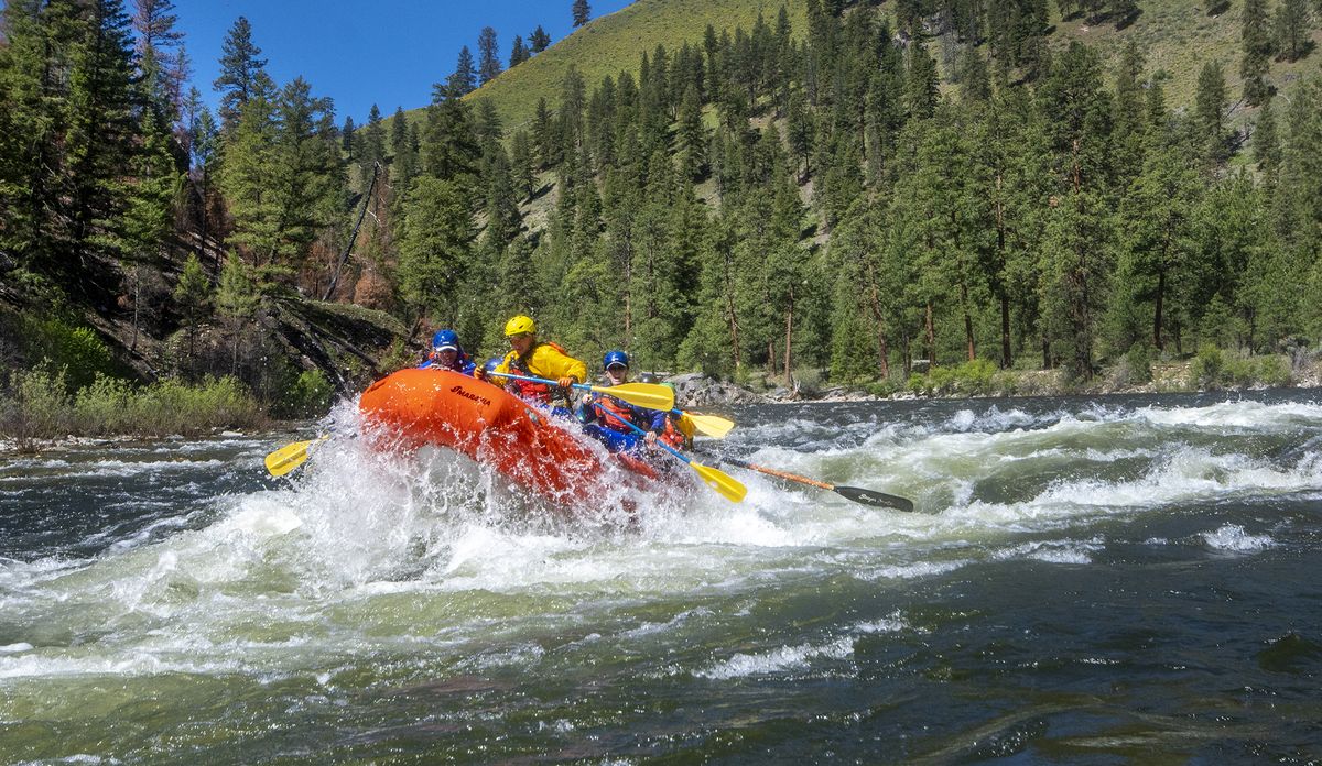 A raft with the author’s group punches through the Marble Creek rapid, one of many Class III drops along the Middle Fork of the Salmon River in central Idaho.  (John Briley)