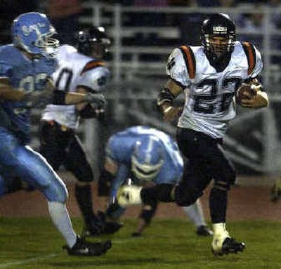 
Lewis and Clark's Ethen Robinson runs for a touchdown during the Tigers' 27-20 win over the Central Valley Bears at Central Valley Friday night. Lewis and Clark's Ethen Robinson runs for a touchdown during the Tigers' 27-20 win over the Central Valley Bears at Central Valley Friday night. 
 (Jed Conklin/Jed Conklin/ / The Spokesman-Review)