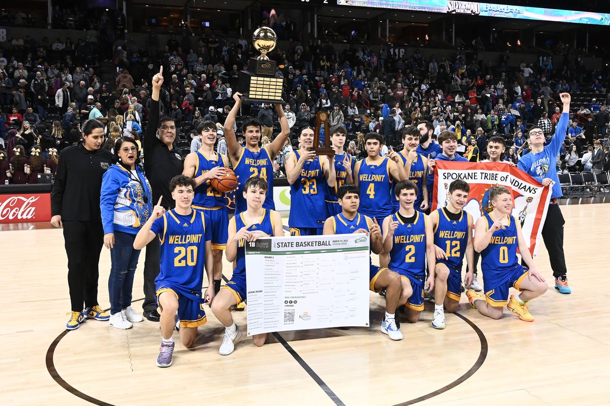 Wellpinit celebrates a 55-50 win over Sunnyside Christian after the State 1B boys championship game Saturday at Spokane Arena.  (James Snook)