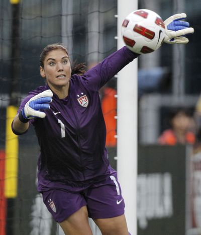 Hope Solo and her U.S. teammates won’t attend Friday’s opening ceremony. (Associated Press)