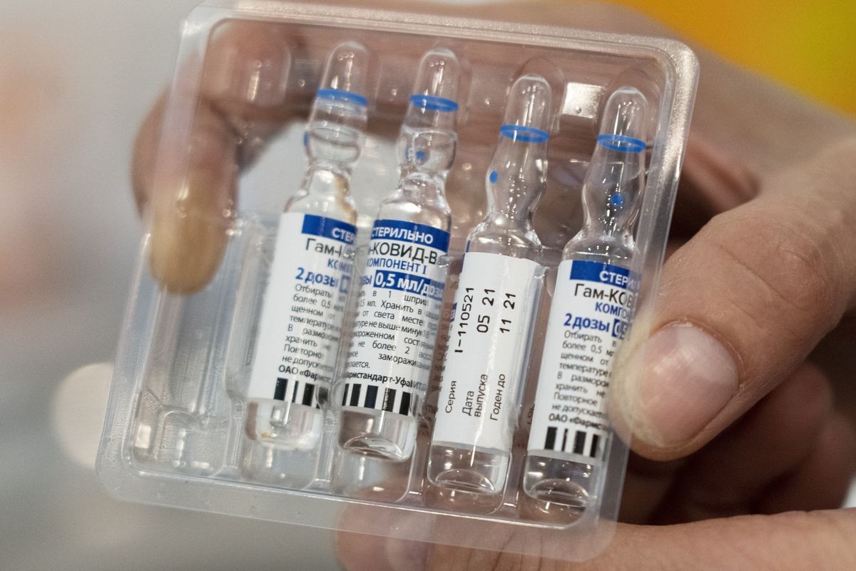 FILE - In this July 1, 2021, file photo, a medical worker shows vials with Russia