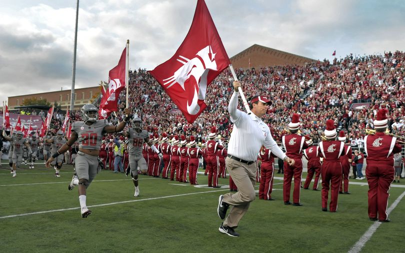 WSU Head Coach Paul Wulff leads his flag carrying players into Martin Stadium in Pullman for their game against Stanford, Oct. 15, 2011. (Christopher Anderson / Spokesman-Review)