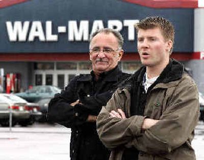 
Pierre Martineau, left, and Patrice Bergeron, two of the Wal-Mart workers who initiated the unionization, stand in front of the store in Jonquiere, Que. 
 (Associated Press / The Spokesman-Review)