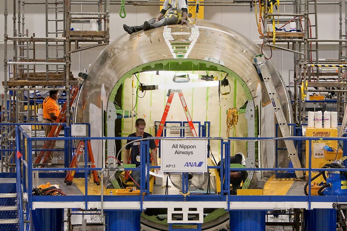 Boeing employees work on an aft fuselage for the 787 Dreamliner inside the North Charleston, S.C., facility Wednesday, Oct. 28, 2009.  Boeing officials said Wednesday that it would open a second assembly plant in North Charleston for the model. (Associated Press)