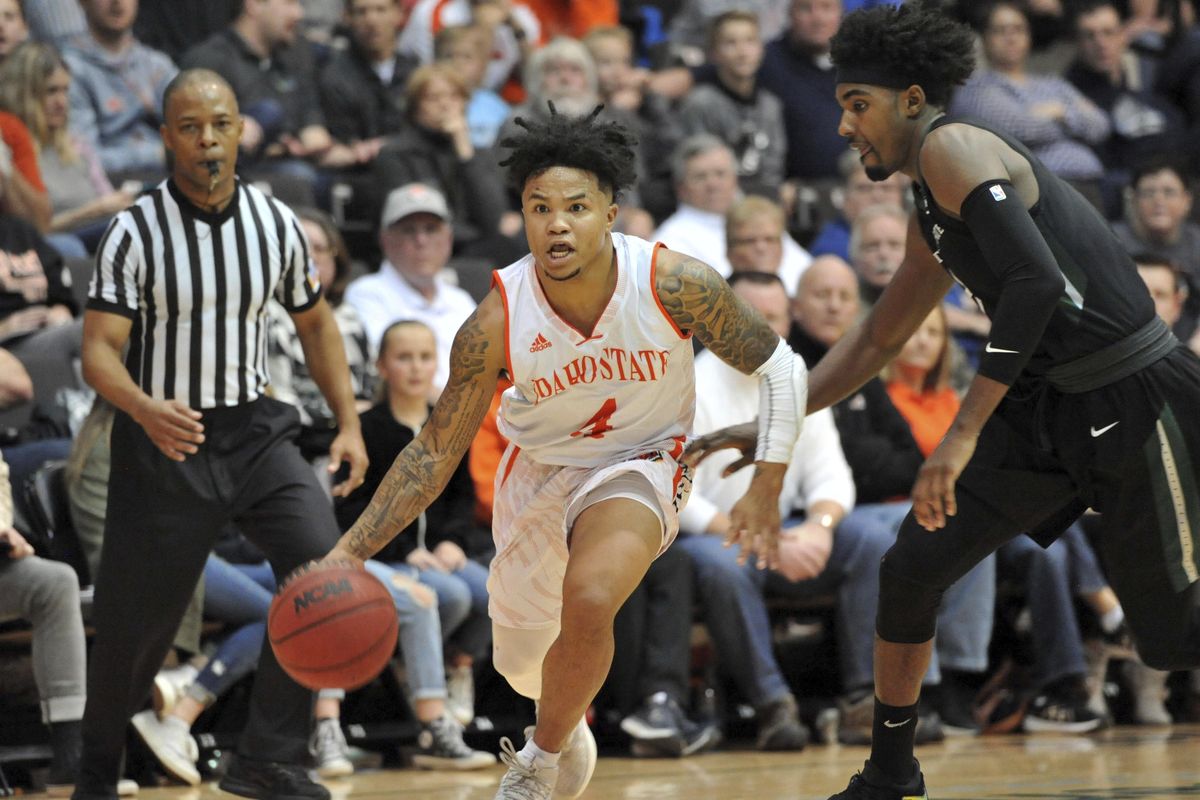 Idaho State’s Sam Dowd  dribbles during an NCAA college basketball game against Youngstown State in Pocatello. Dowd found himself homeless at 13 and spent the next few years living with friends, occasionally sleeping outside the school when he had no place to go. Thanks to hard work and the generosity of coaches and families along the way, the undersized point guard realized his dream of playing Division I basketball at Idaho State. (Julie Hillebrant / Associated Press)