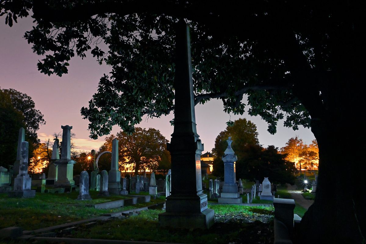 The Congressional Cemetery is slowly overcome by night as the sun goes down in Washington, D.C., on Oct. 18.  (Michael S. Williamson/Washington Post )