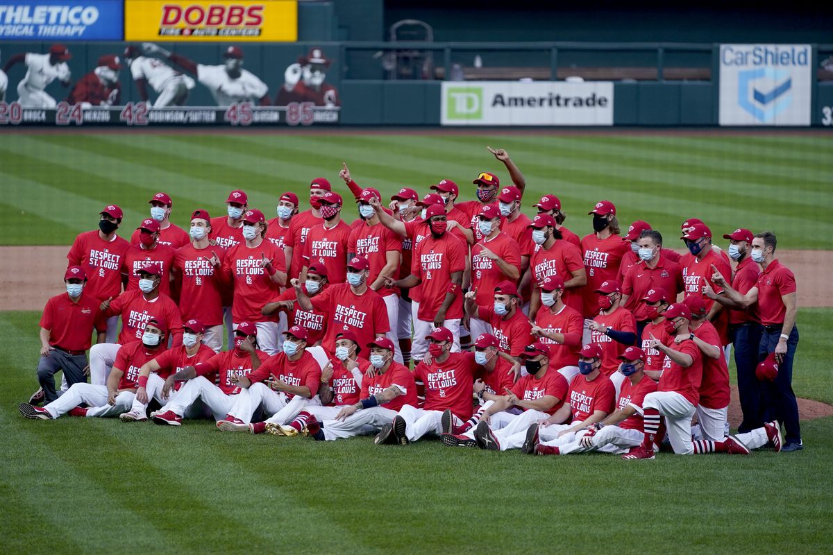 Members of the St. Louis Cardinals celebrate after defeating the Milwaukee Brewers in a baseball game to earn a playoff birth Sunday, Sept. 27, 2020, in St. Louis. (Jeff Roberson)