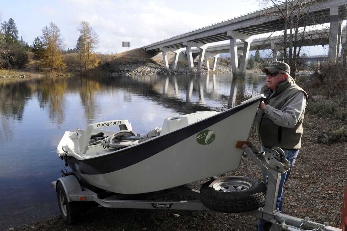 Spokane fly fisherman Stann Grater launches his drift boat at an unofficial site just downstream of Interstate 90 at Stateline. River access on the 111-mile Spokane River corridor is limited, and Grater and other fly fishermen advocate more access points. The proposed realignment of the Centennial Trail at Gateway Park will still allow access to the informal boat launch. (J. BART RAYNIAK)