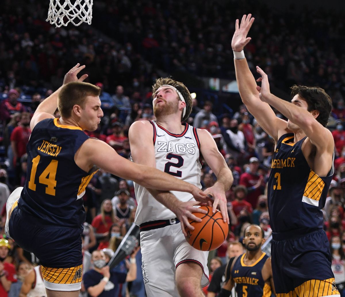 Gonzaga forward Drew Timme (2) is fouled by Merrimack guard Devin Jensen (14) during an NCAA college basketball game, Thursday, Dec. 9, 2021, in the McCarthey Athletic Center.  (COLIN MULVANY/THE SPOKESMAN-REVIEW)