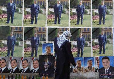 
Posters show Lebanon's slain former Premier Rafik Hariri, in Beirut, on Saturday. 
 (Associated Press / The Spokesman-Review)